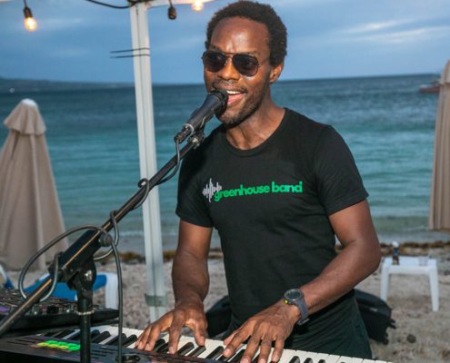 Keyboard player from Greenhouse Band at Reggae Beach Lobster Fest