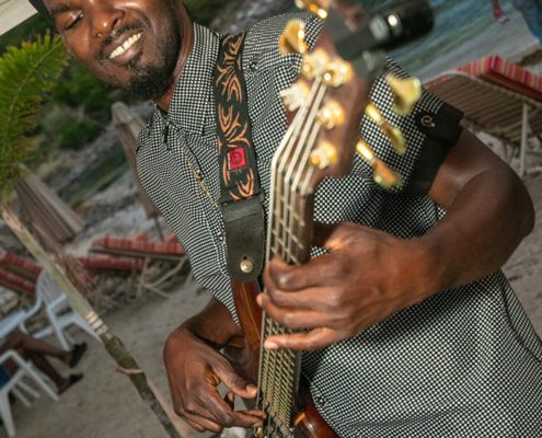 Guitar player from Greenhouse Band at Reggae Beach Lobster Fest